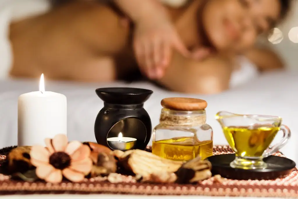 Warm aroma oil massage in Bangkok spa – soothing therapy with organic essential oils