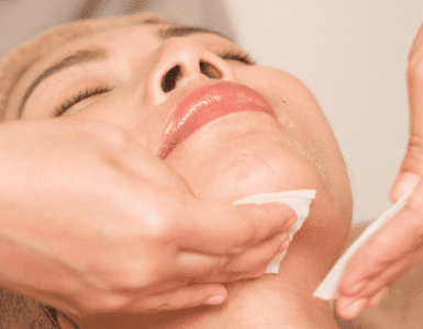 The photo is cleaning and detoxification of the face with cotton pad.