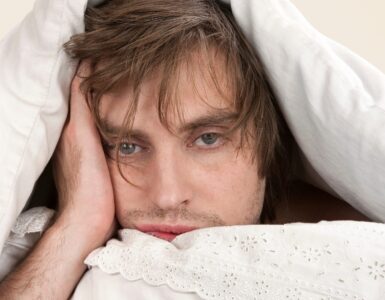 Man can not sleep in the white bedsheet