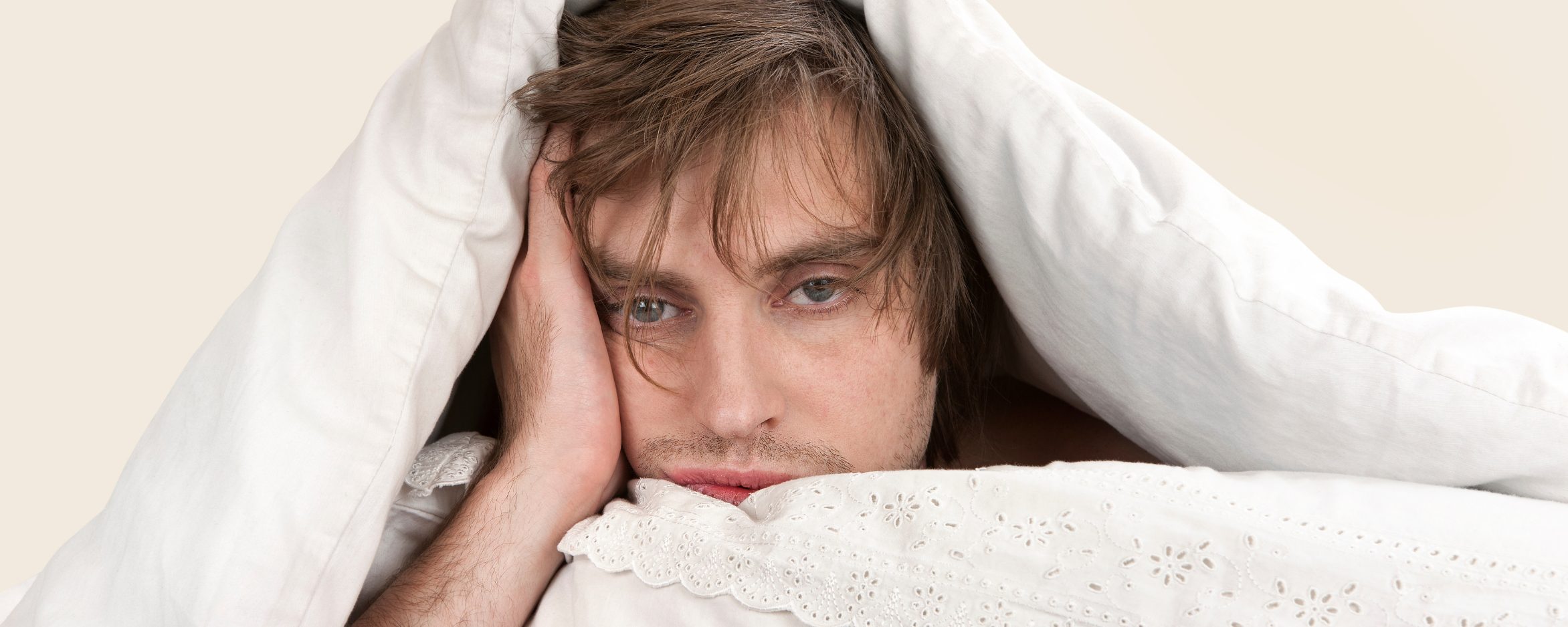 Man can not sleep in the white bedsheet